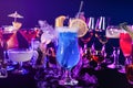 Blue lagoon drink with blue curacao at bar counter close up. Bartender show and prepared cocktail with dry ice Royalty Free Stock Photo