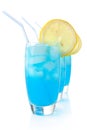 Blue lagoon drinks with slice of lemon with ice cubes on white Royalty Free Stock Photo