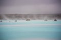 The Blue Lagoon geothermal spa and lava rocks in Iceland. Royalty Free Stock Photo