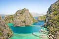 Blue lagoon with longtail boats by Karangan Lake in Coron Palawan - Beautiful tropical destination in Philippines - Travel Royalty Free Stock Photo