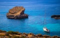 Blue Lagoon, Malta - Sailing boat at the famous Blue Lagoon at the Island of Comino on bright sunny summer day Royalty Free Stock Photo