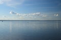 Blue lake and boat on sky clouds background Royalty Free Stock Photo