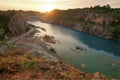 Blue lake on a manmade canyon and sunset