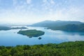 Blue lake with many small islands among green mountains. Montenegro, Niksic, view of Salt Lake