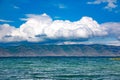 Blue lake, mountains and clouds Royalty Free Stock Photo