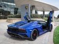 Blue Lamborghini Aventador, doors open