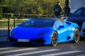 Blue Lamborghini Huracan sports car, front and left side view