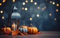 Blue lantern with burning candle on wooden floor decorated in autumnal style, pumpkins, maple leaves. Blurred bokeh lights. Royalty Free Stock Photo