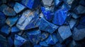 Blue lapis lazuli raw crystals, natural stones background