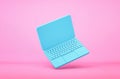 Blue laptop flying on pink background Royalty Free Stock Photo