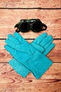 Large welding mittens and glasses for welding, on wooden background Royalty Free Stock Photo
