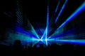 Blue laser show nightlife club stage with party people crowd Royalty Free Stock Photo