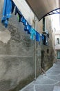 Lauandry drying in a quaint little street in a village in Calabria, Italy