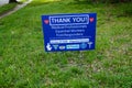 A blue lawn sign giving thanks to medical professionals for their service during the pandemic