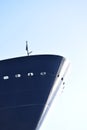 Blue lean bow of a cruise ship in closeup with blue sky in the back Royalty Free Stock Photo