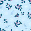 Blue leaves, red berries, fir branches, white snowflakes and dots on a light blue background. Seamless winter pattern. Royalty Free Stock Photo