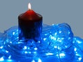 Blue LED and the candle Royalty Free Stock Photo