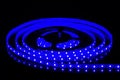 Blue LED strip on reel with black background Royalty Free Stock Photo