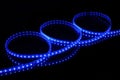 Blue LED strip tape on black background Royalty Free Stock Photo