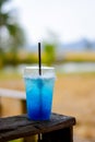 Blue lemon soda on wood table.