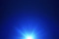 Blue lens flare with bright light isolated on black background