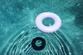 A blue life ring in a swimming pool in summer time Royalty Free Stock Photo