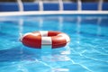 blue lifesaver buoy floating in a swimming pool