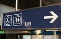 Blue lift or elevator symbol at platform.