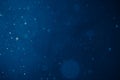 Blue light background with snowflakes particles Royalty Free Stock Photo