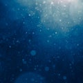 Blue light background with snowflakes particles Royalty Free Stock Photo