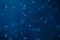 Blue light background with snowflakes particles Royalty Free Stock Photo