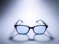 Blue light blocking glasses. Black frame glasses for filtering blue light from the computer. Prevent Computer Vision Syndrome. Eye Royalty Free Stock Photo