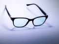 Blue light blocking glasses. Black frame glasses for filtering blue light from the computer. Prevent Computer Vision Syndrome. Eye Royalty Free Stock Photo