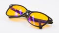 Blue light blocking glasses with yellow lenses Royalty Free Stock Photo