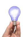 Blue light bulb in hand Royalty Free Stock Photo