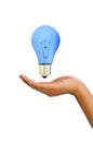 Blue Light bulb in hand Royalty Free Stock Photo