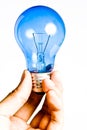 Blue light bulb in hand, Isolated Royalty Free Stock Photo