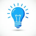 Blue light bulb icon on a white background. The design features a stylized bulb with Royalty Free Stock Photo