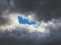 Blue light in the dark clouds. Colorful cloudy sky at sunset. Sky texture, abstract nature background, soft focus Royalty Free Stock Photo