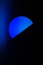 Blue light in the dark. Room lamp in the bedroom. The blue color of the light source