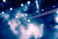 Blue light rays from the spotlight through the smoke at the theater or concert hall. Lighting equipment for a performance or show Royalty Free Stock Photo