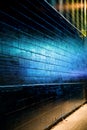 Blue light reflect on Brick Wall