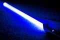 Blue light Sword Saber Laying on Carpet Floor Royalty Free Stock Photo