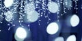 Blue lights bokeh from christmas holiday garlands, blurred festive background, abstract lights Royalty Free Stock Photo