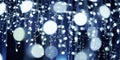 Blue lights bokeh from christmas holiday garlands, blurred festive background, abstract lights Royalty Free Stock Photo