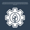 Blue line Leaf plant ecology in gear machine icon isolated on blue background. Eco friendly technology. World Royalty Free Stock Photo