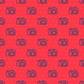 Blue line Photo camera icon isolated seamless pattern on red background. Foto camera. Digital photography. Vector Royalty Free Stock Photo