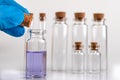 Blue liquid in a glass vial. Accessories in the laboratory Royalty Free Stock Photo