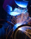 Blue lit MIG welder close