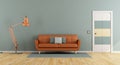 Blue living room with orange sofa